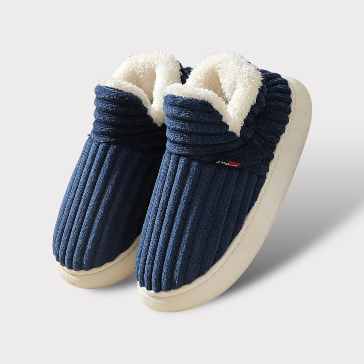 Blauwe comfort fleece pantoffels met witte fleece voering en witte rubberen zool.