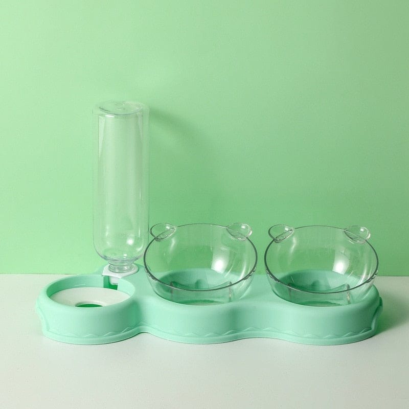 Groene voedertray met voerbakken en waterdispenser.