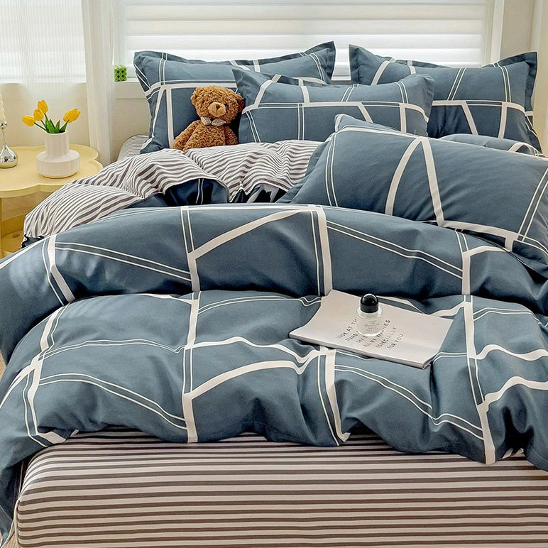 CottonNest beddengoed met blauwe geometrie, dekbedovertrek en bijpassende kussenslopen