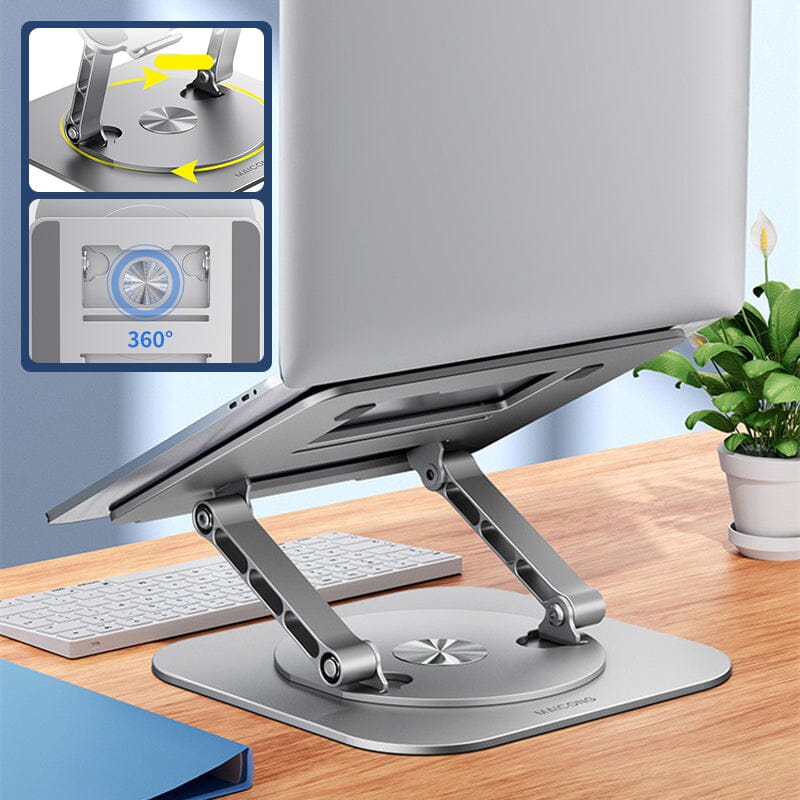 Laptop op 360 graden standaard met toetsenbord en plant.