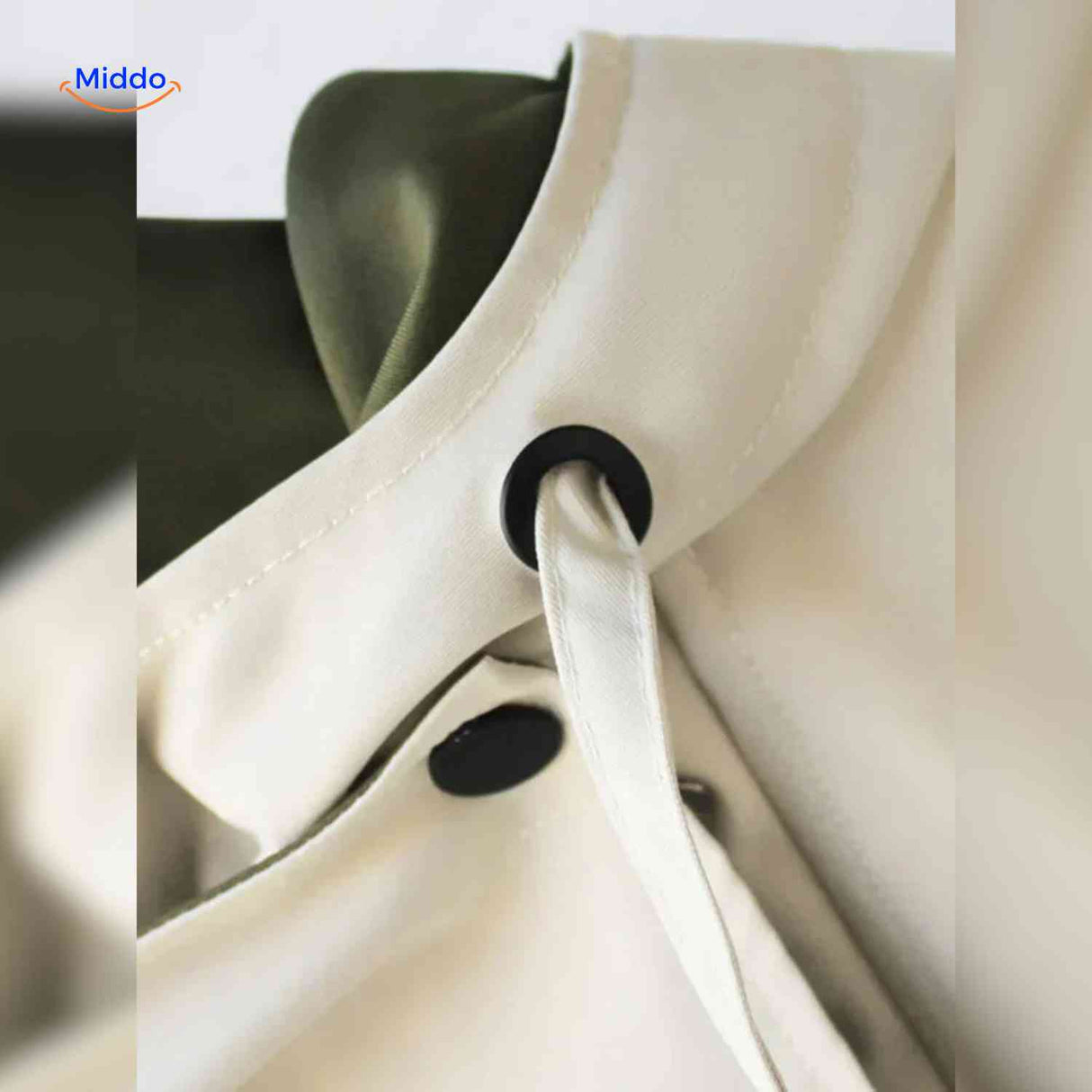 AquaShell jas detailfoto creme met groen en knopen www.middo.nl