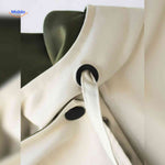 AquaShell jas detailfoto creme met groen en knopen www.middo.nl