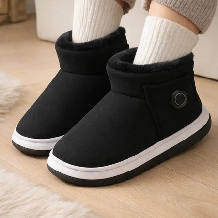 Black rechargeable heated indoor boots indoor lifestyle view