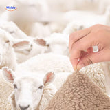 LuxeLamb Sofa Kussens sheeps wool sensation with hand www.middo.nl