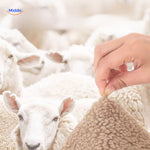 LuxeLamb Sofa Kussens sheeps wool sensation with hand www.middo.nl