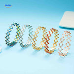 Morphix Ring goud brede ring met rode strass www.middo.nl