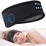 Vrouw slaapt comfortabel met een zwarte Sleepband met Bluetooth