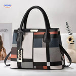 VivaLuxe Tote stijlvolle handtas met ondersteunende riemen en pompon www.middo.nl