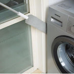 Uitschuifbare stofdoek naast wasmachine.