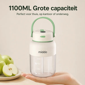Compacte en draagbare JuiceX blender van 1100 ml in wit met groene details.