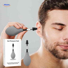 otorelief oordrukapparaat gebruikt door man tegen hoofddruk www.middo.nl