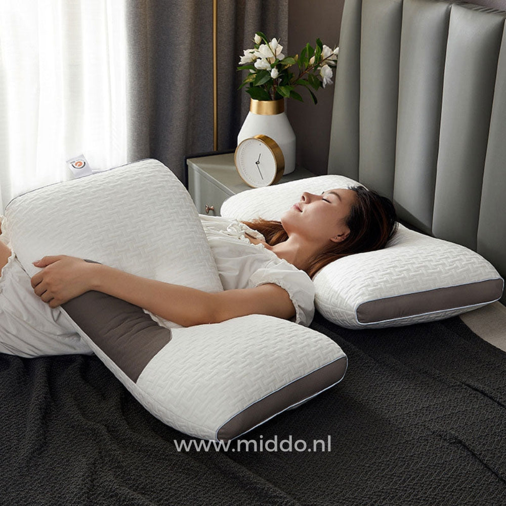 Vrouw ligt comfortabel met het DreamGuard Pro neksteunkussen.