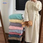 snugglewear dekenjurk wit gestapeld in kleuren opties www.middo.nl